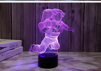 3D astronaut LED night light with USB plug showing dimensional design and compact bedside placement