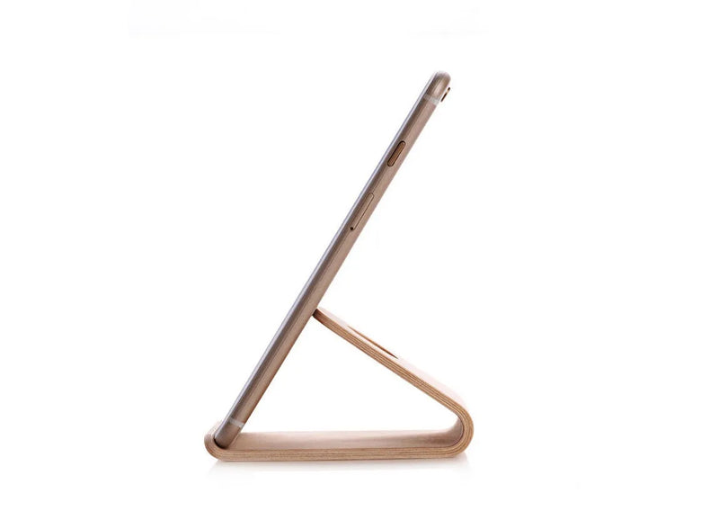 Wooden iPhone stand compatible with Apple iPhone models, crafted from solid wood in Walnut or White Maple finish for desk organisation and hands-free viewing at home or in the office
