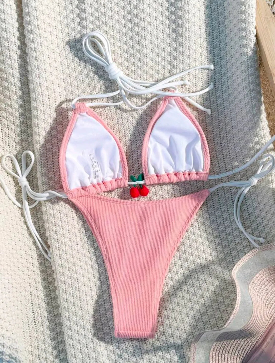 Women's sexy wind style bikini swimsuit in a solid colour, showing backless briefs design.