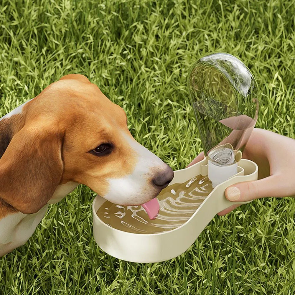 Orange and white portable pet water bottle with attached food container and carry sling.
