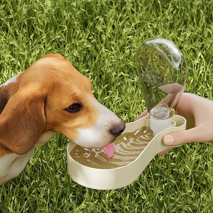 Orange and white portable pet water bottle with attached food container and carry sling.