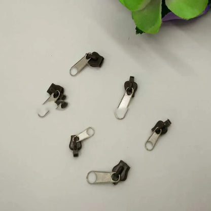 12-piece zipper head replacement kit in black, grey, and brown colours with snap-on installation