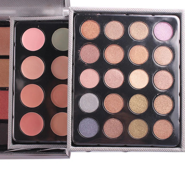 Multifunctional makeup artist kit showing 94 colour eye shadow palette with concealers, lipsticks, and application tools