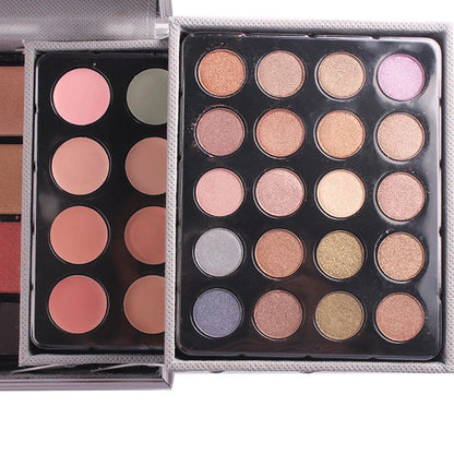 Multifunctional makeup artist kit showing 94 colour eye shadow palette with concealers, lipsticks, and application tools