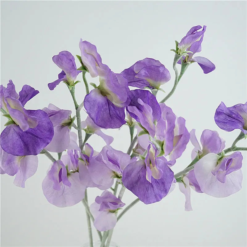Artificial silk pea flower single stem in pink, purple, red, or white colours measuring 40cm height