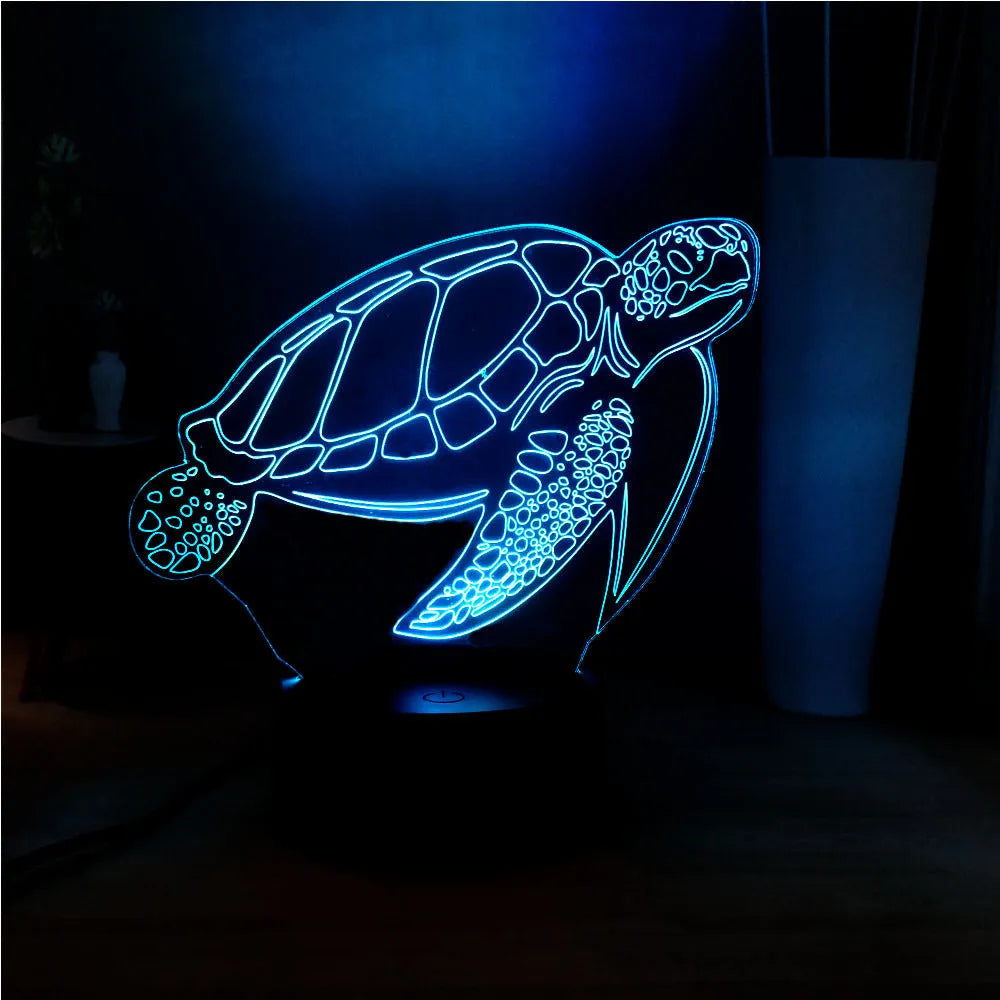3D acrylic turtle-shaped LED night light showing one of its 16 colour options on a bedroom shelf.