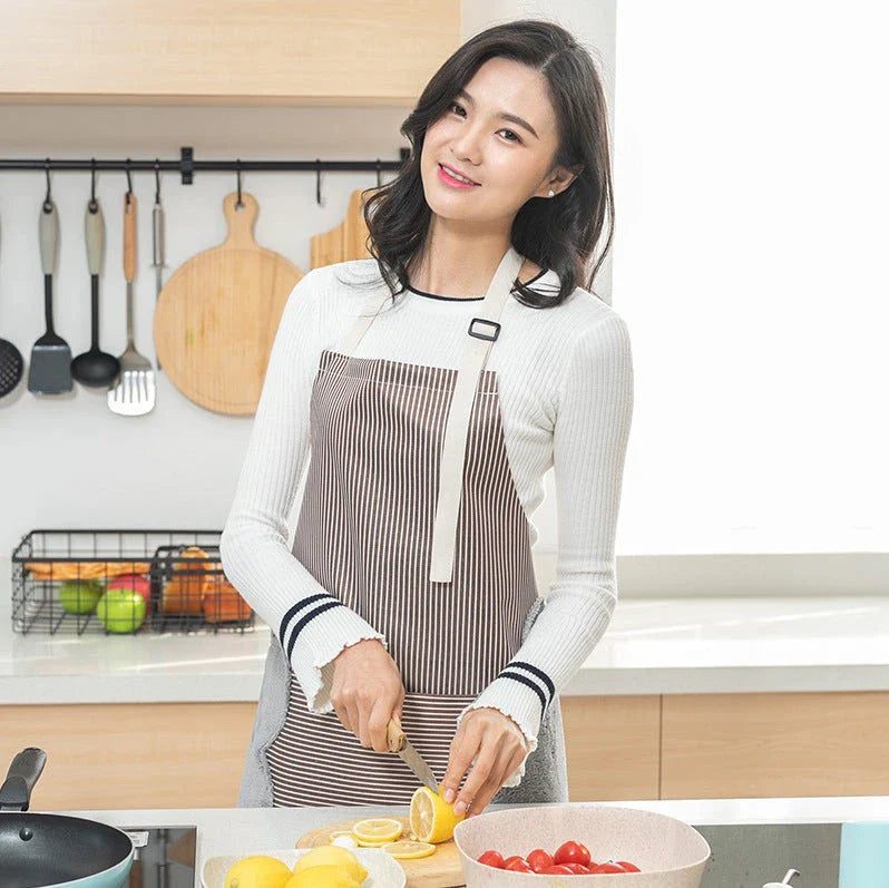 Adjustable waterproof kitchen apron with towel pockets, featuring a sleek Nordic-inspired design and made with durable Oxford cloth and soft polyester velvet.