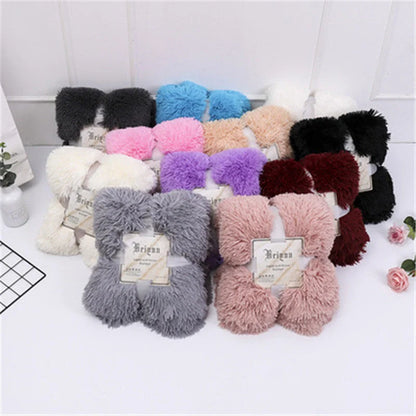 Soft coral fleece blanket in various colours and sizes for home and travel comfort