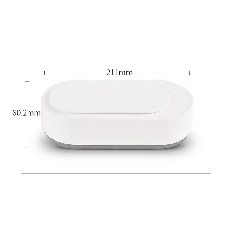 White portable ultrasonic cleaner with stainless steel tank for cleaning jewellery and glasses.