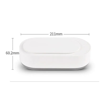 White portable ultrasonic cleaner with stainless steel tank for cleaning jewellery and glasses.