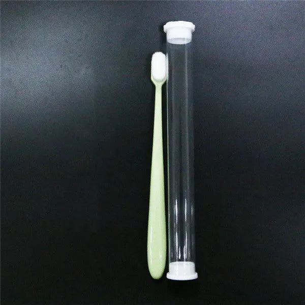 Micron soft toothbrush with coloured handles and different bristle styles including flat head and wavy designs