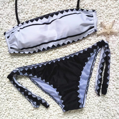 Women's strapless bikini set with tie-side bottoms in durable polyester-nylon blend.