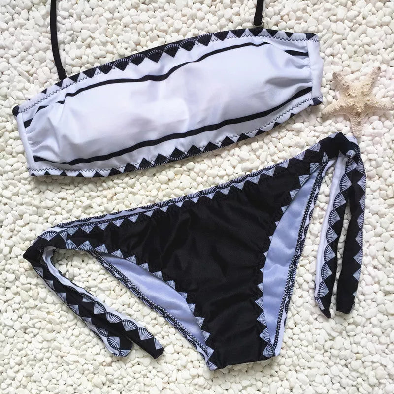 Women's strapless bikini set with tie-side bottoms in durable polyester-nylon blend.