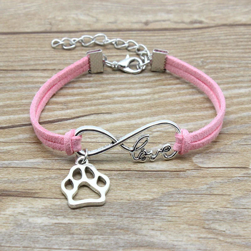 Stylish hand-woven infinite love pet bracelet in various colours, featuring a bow design and made of premium alloy materials