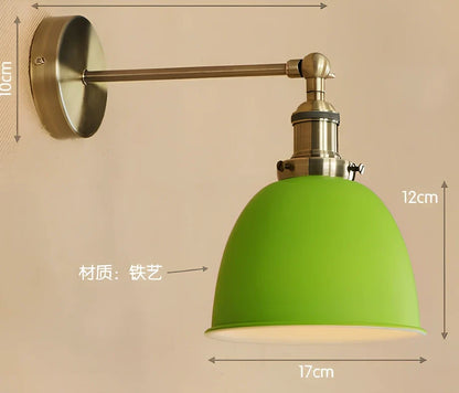 Bedroom wall light with 15cm wide iron shade in pink colour, mounted 20cm projection for soft illumination