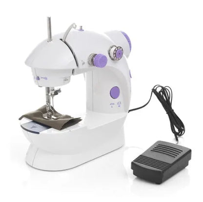 Compact white mini electric household sewing machine with work light and thread cutter.