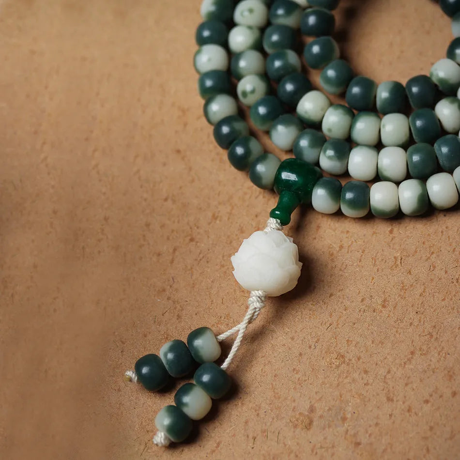 Lotus white jade Bodhi root bracelet with floating flowers pattern on 8x10mm beads