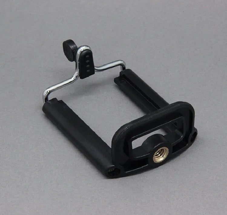 Black octopus tripod with flexible rubber legs wrapped around a pole, holding a smartphone.
