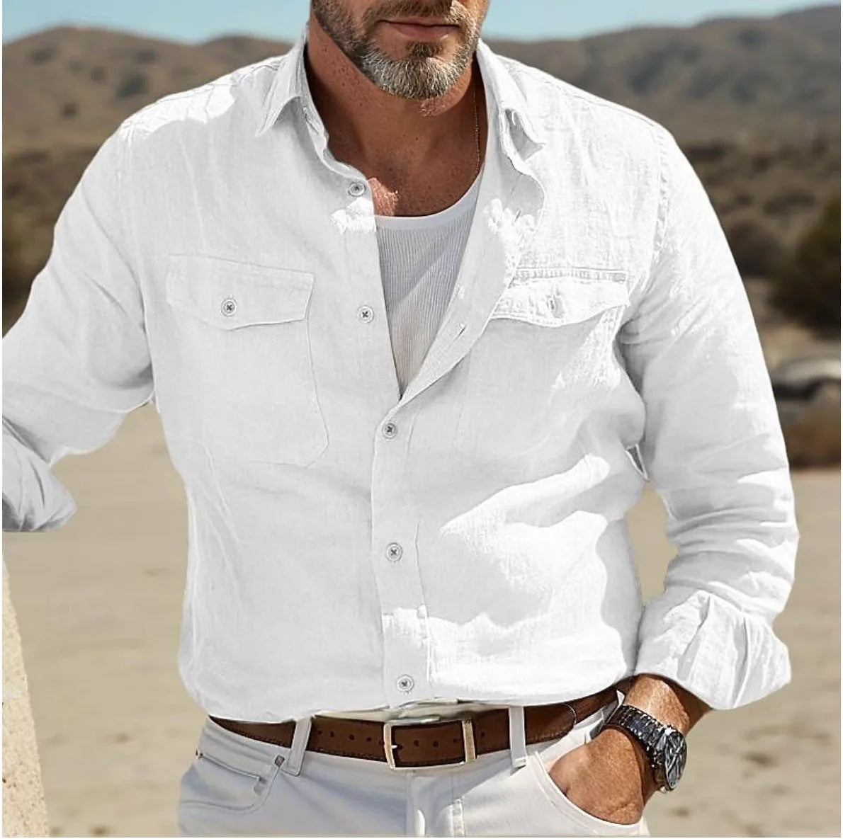 Men's long-sleeved cotton and linen shirt in green, loose fit on a hanger.