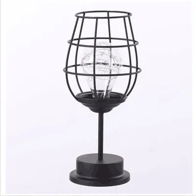 Minimalist wrought iron table lamp shaped like wine bottle with warm white LED light