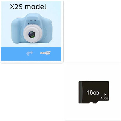 X2 HD mini digital camera for kids in silicone case with lanyard, shown capturing photo on 2-inch screen.