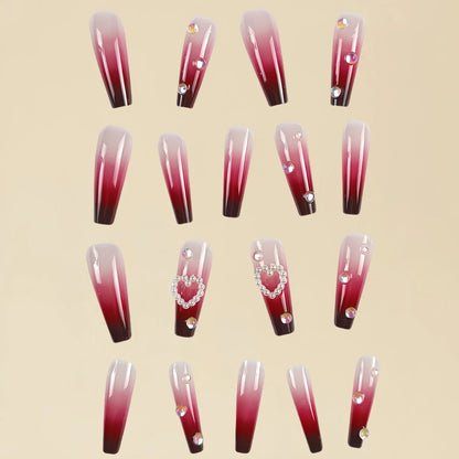 Set of long false nail tips with wine red gradient colour, plaid pattern, and a pearl heart design.