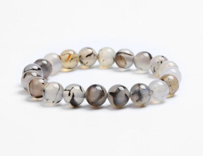 Handcrafted beaded bracelet with seven chakra-representing beads, designed to promote balance and well-being.