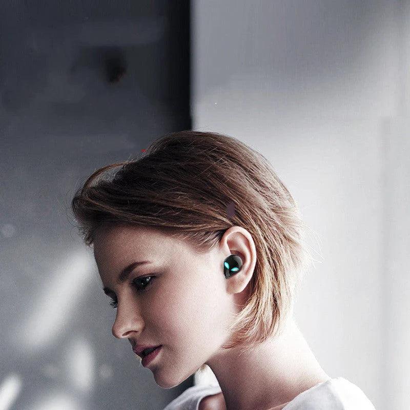 Creative Outer T8 Starman Bluetooth Headset with alien-inspired design, vibrant LED lights, and wireless charging capabilities