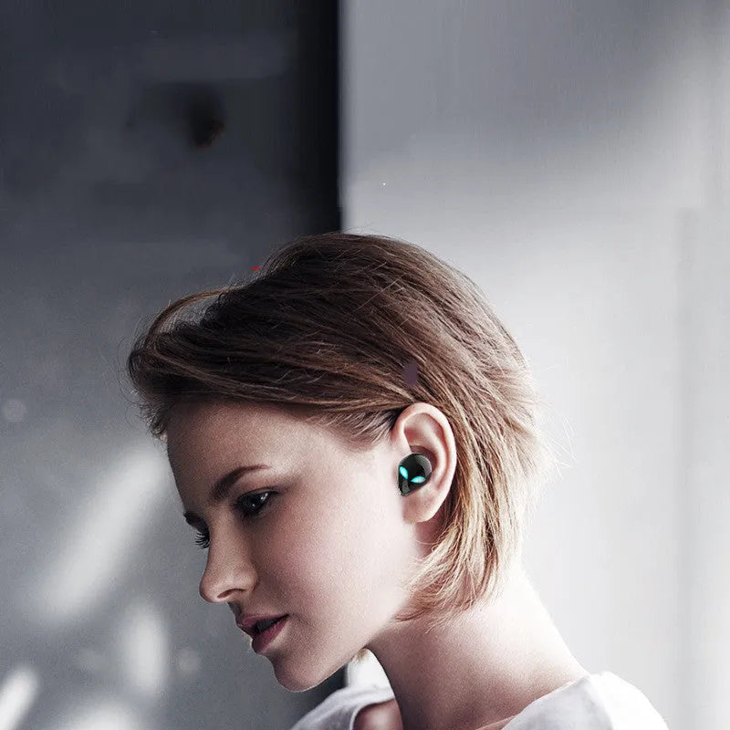 Creative Outer Starman T8 alien-design wireless Bluetooth earbuds and charging case in black.