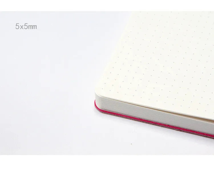 Blue soft imitation leather A5 dotted notebook open on dot grid pages.