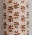 Festive rolling pin with embossed Christmas designs for easy imprinting on dough