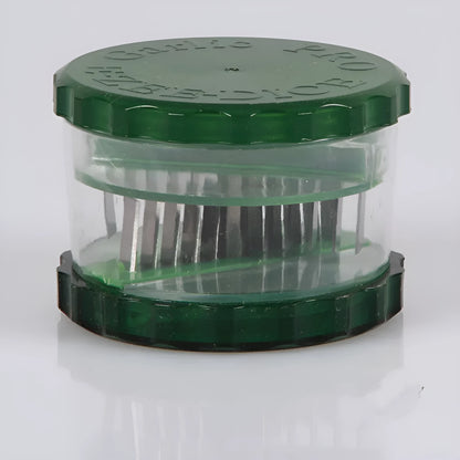 Transparent green garlic peeler measuring 8.5 by 8.5 by 6 centimetres with garlic cloves visible inside