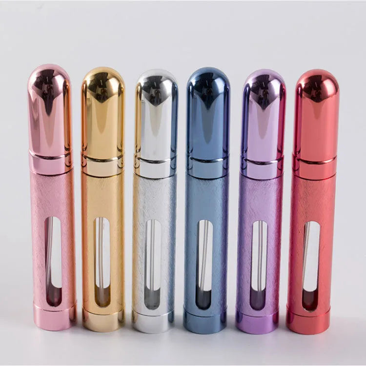 Slim 12ml aluminium travel perfume bottle with glass liner in bullet shape, shown in various colours.