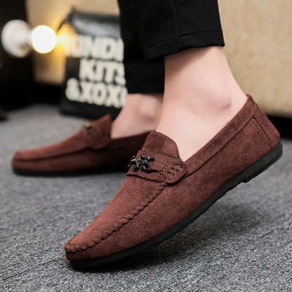 Men's black waterproof slip-on loafers with round toe and low heel on a rubber sole.