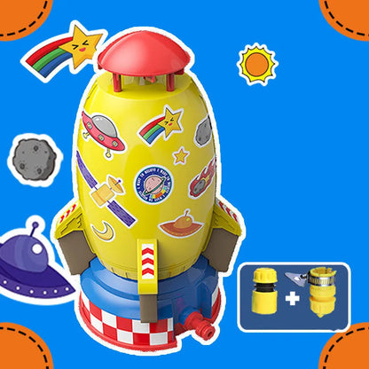 Yellow outdoor water pressure rocket launcher toy for kids on a green lawn.