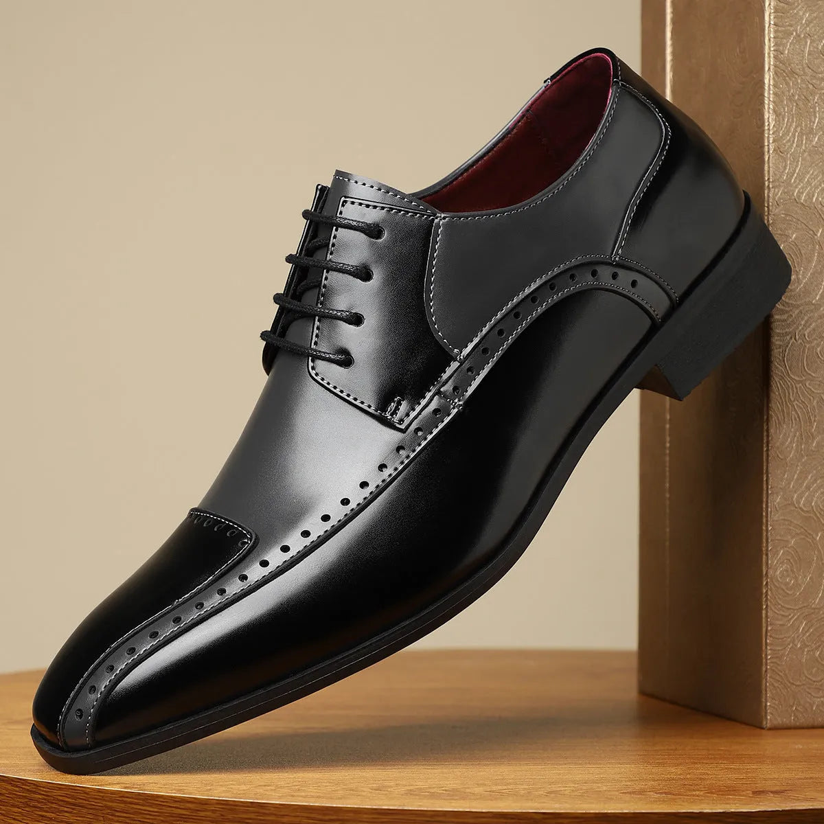 Men's black leather business casual shoes with stitching detail and a low-top design.
