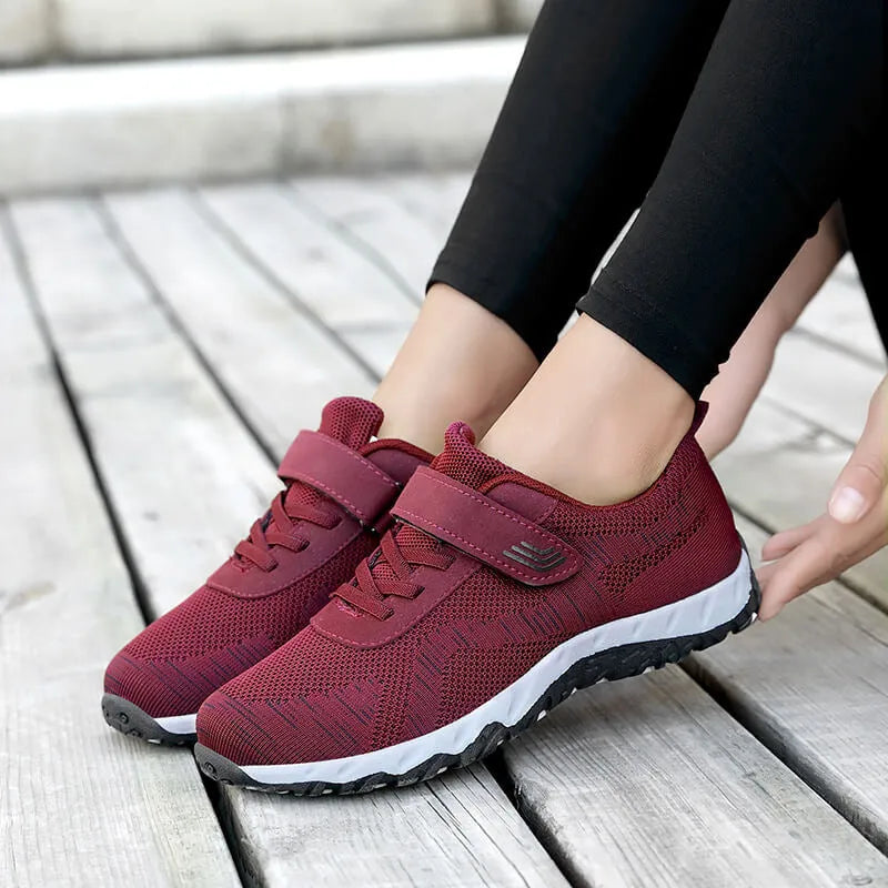 Women's gray purple casual shoes with mesh upper, wedge heel, and Velcro strap.