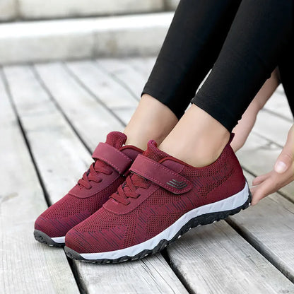 Women's gray purple casual shoes with mesh upper, wedge heel, and Velcro strap.