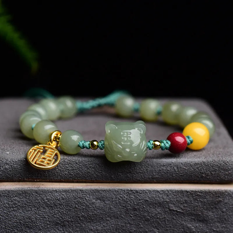 Natural Hetian Jade bracelet with animal Zodiac designs and cinnabar beeswax accents