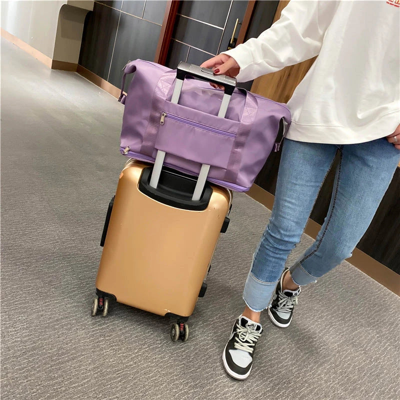 Spacious gym travel bag in various colors, featuring multiple pockets and comfortable carrying handles for workout, yoga, and outdoor use.