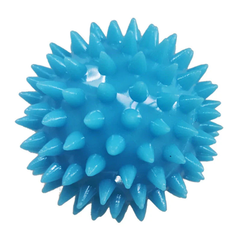 Therapeutic hand grip massager with massage bumps and finger holes for improving grip strength and relaxing hand muscles