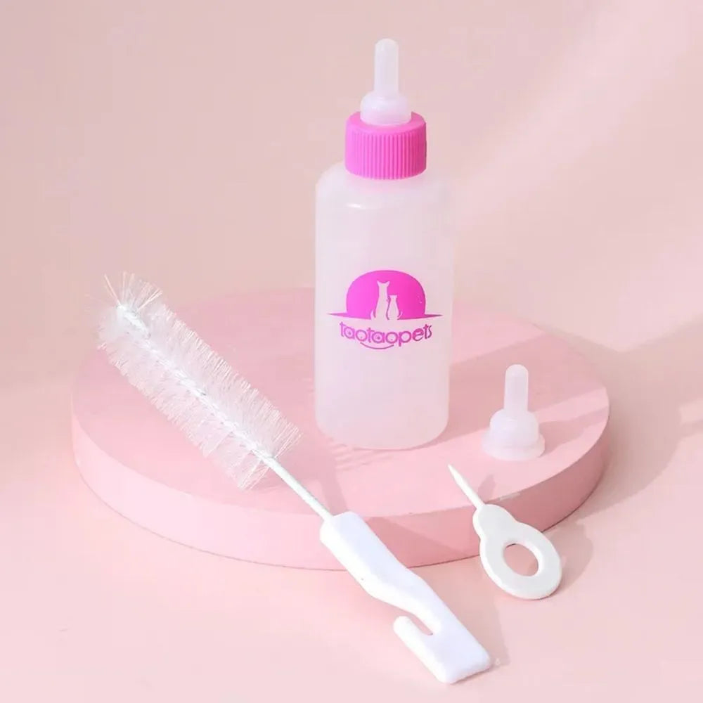 Set of four coloured pet milk bottles with silicone teats and a cleaning brush for small animals.