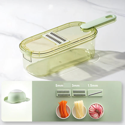 Shredded vegetable slicer with stainless steel blades on green cutting board