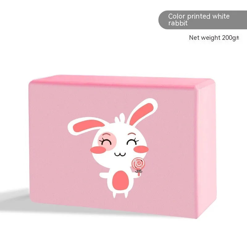 High-density EVA foam yoga block in violet colour, shown next to a pink block with a cartoon bunny print.