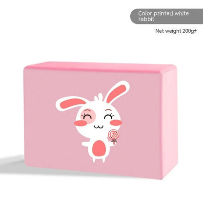 High-density EVA foam yoga block in violet colour, shown next to a pink block with a cartoon bunny print.