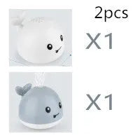 Grey or white electric whale bath toy spraying water with LED lights on a base.