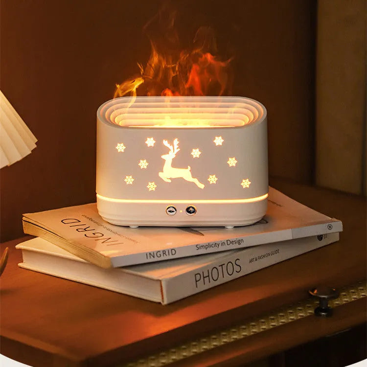 White round Elk flame effect humidifier and essential oil diffuser on a surface with mist and light on.