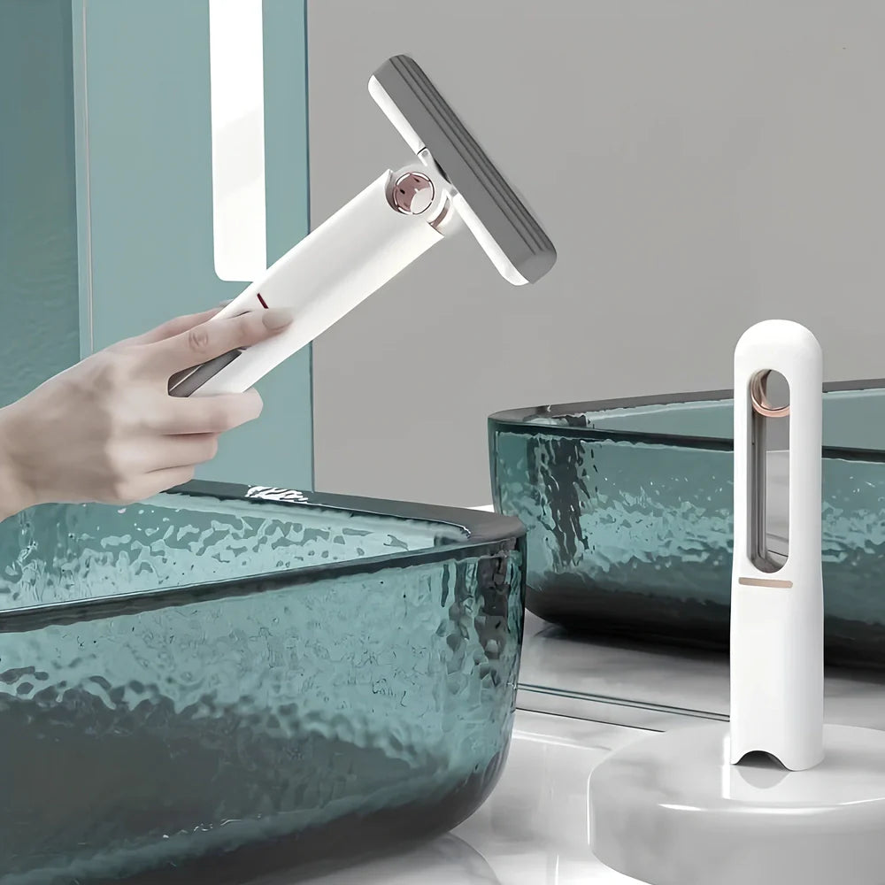 Portable self-squeezing mini mop with biodegradable cotton head and 180-degree folding mechanism