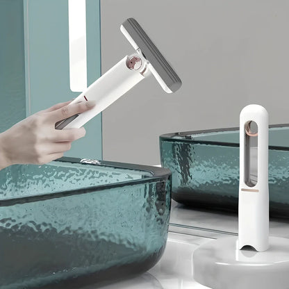 Portable self-squeezing mini mop with biodegradable cotton head and 180-degree folding mechanism