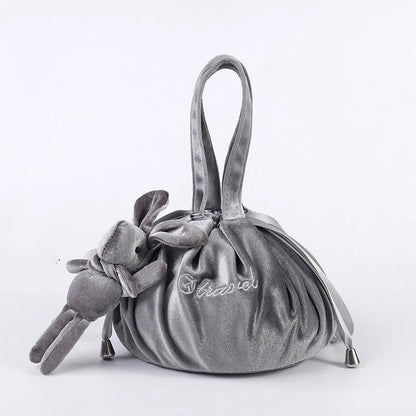 Adorable rabbit ear velvet cosmetic bags in various colors for storing and organizing makeup, toiletries, and other beauty essentials.